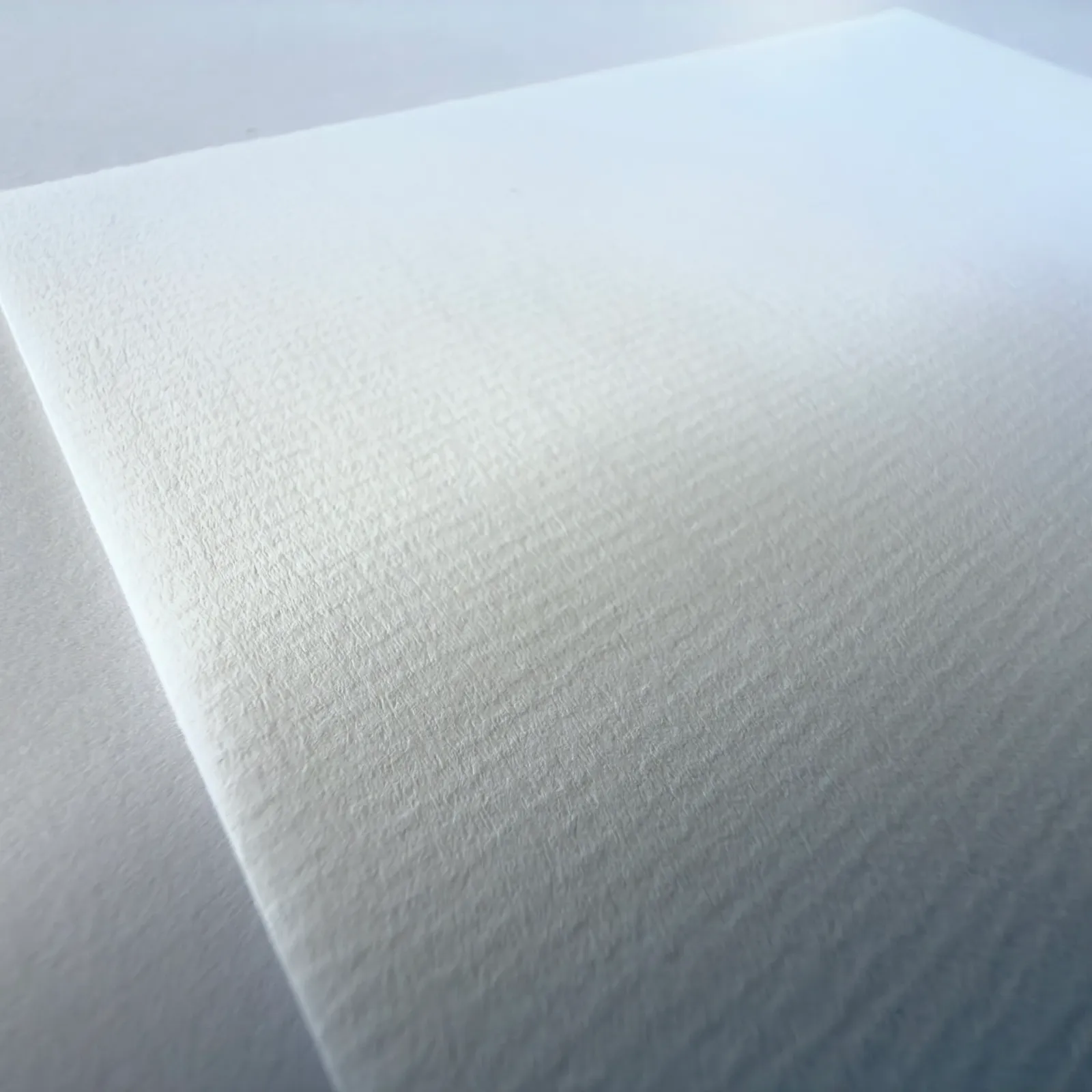 Premium Textured White – Närbild på pappersstrukturen
